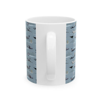 Blue ceramic mug with airplane illustration, available in 11oz and 15oz sizes, great for coffee lovers.